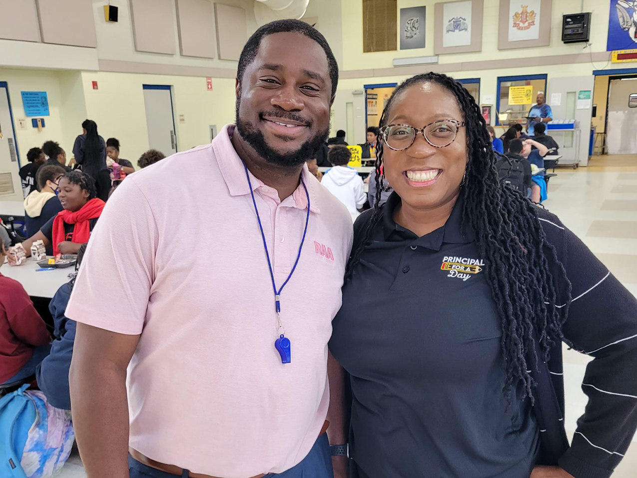 Kenyatta Rosier and Dr. Marcus Scott on lunchroom duty at Augusta Raa Middle School!